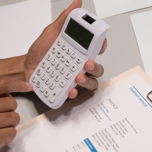 close up shot of a person using calculator